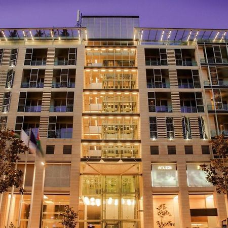 עמאן The Abdali Boulevard Hotel מראה חיצוני תמונה The hotel at night